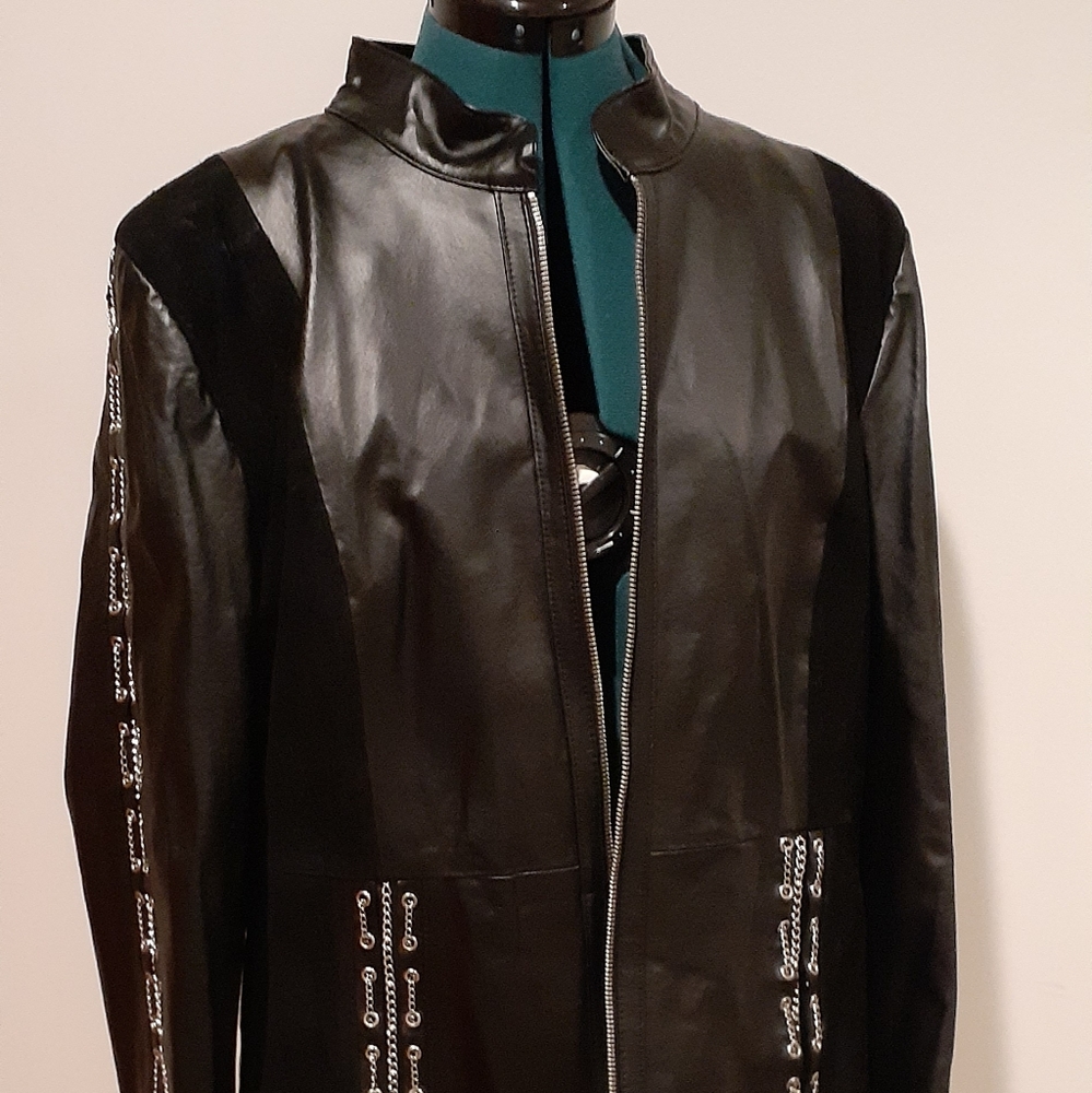 Black, Pamela Mccoy, leather jacket with chains.